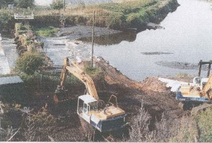 59 removing old weir after